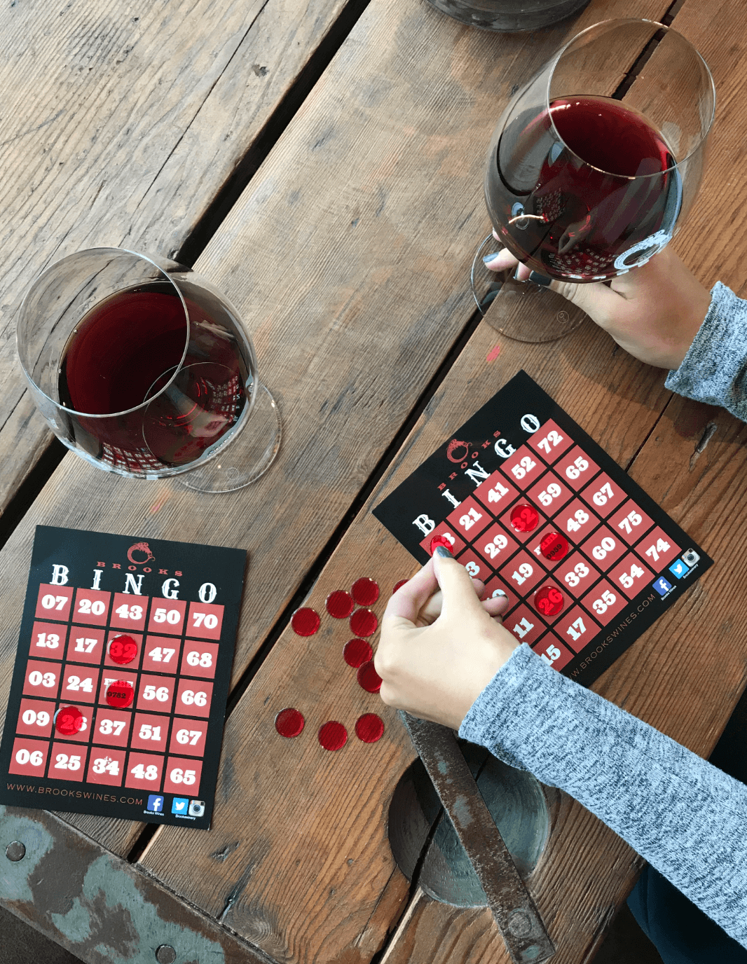 An overhead image of a family-friendly game of bingo while adults sip world-famous Willamette Valley Pinot Noir.